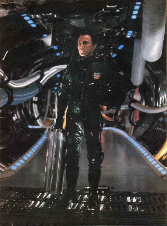 Harvey Keitel poses with Hector's brain case (production still).