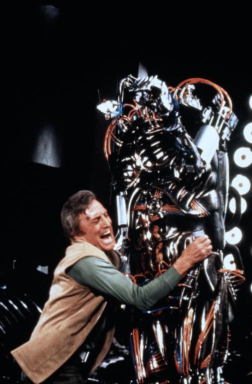 An explosive-laden Adam wrestles Hector into the sludge pit.