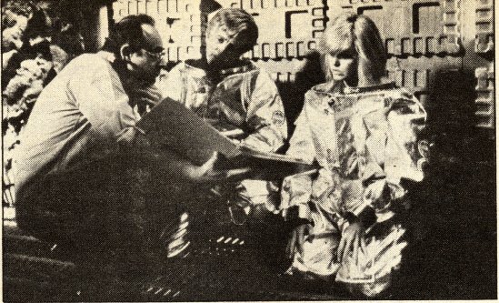 Stanlet Donen confers with Kirk and Farrah prior to filming their attempted escape in James' shuttle.